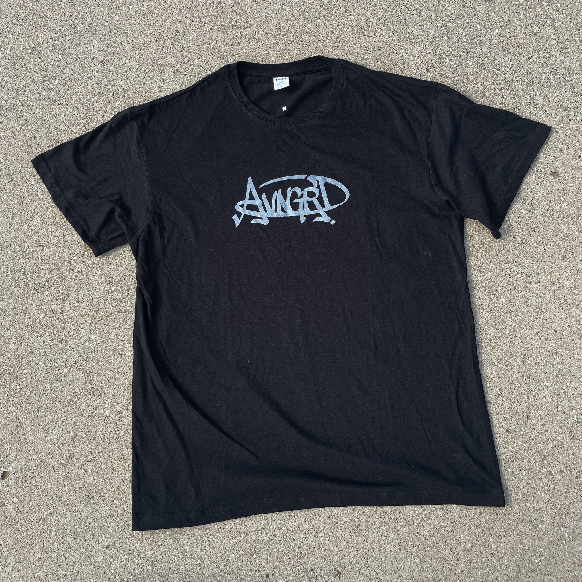 FRONT VIEW OF A BLACK T-SHIRT WITH GRAPHICS ON FRONT AND BACK